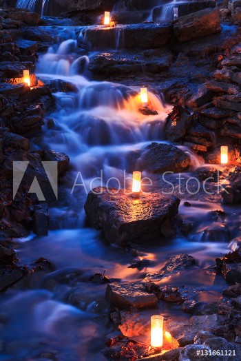 Picture of Waterfall with Multiple Candles at Twilight